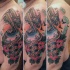Sweet looking colored shoulder tattoo of flying plane flowers and lettering
