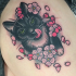 Sweet looking colored thigh tattoo of beautiful cat with flowers