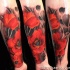Sweet painted colored realism style red flowers tattoo of forearm