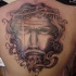Viso di Gesù Cristo tatuato sulla schiena