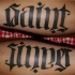 Le tatouage d'ambigramme des mots le saint et le pécheur