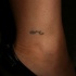Tatouage de petit signe sur la cheville