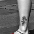 Guitare le tatouage sur la cheville