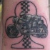 Motocyclette le tatouage sur la cheville