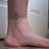 Tatouage sur la cheville de croix