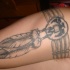 Tatuaggio  le piume in stile indiano