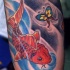 Carpa giapponese con la farfalla tatuati