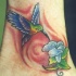 colibri con fiore tatuaggio colorato