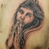 cristo prega in corona di spine tatuaggio