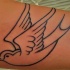 passero volante nero tatuaggio