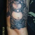 budda sorridente grasso pietra tatuaggio