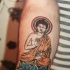 Le tatouage de Bouddha en méditation en couleur