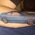 regolare sedan blu macchina tatuaggio sul braccio