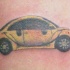 moderno volkswagen coleottero giallo tatuaggio