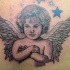 Tatuaje en color de precioso angelito