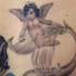 cherubino tiene coda sirena tatuaggio