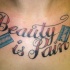 Beauty & pain chest tattoo