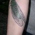 Un gros tatouage réaliste de cicada