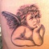classico cherubino riflessivo tatuaggio