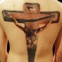 Tatuaggio grande realistico  sulla schiena la cricifissione
