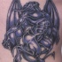 demonio alato blu tatuaggio