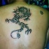drago cinese tribale tatuaggio sulla schiena