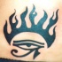 occhio di horus con fiame tatuaggio