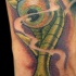 verde occhio demonico tatuaggio