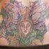 Tatuaje a color de hada en bajo espalda