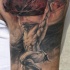 Tatuaje de Atlante apoyando la Tierra