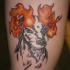 Tatuaje de cabra con cuernos en fuego