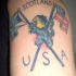 USA e scozese bandiere e leone tatuaggio