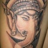 tatuaje obra de arte en tinta negra de Ganesha