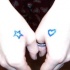 Piccola stella e piccolo cuore tatuati sulle mani
