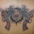 Heartigram with guns tattoo