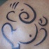 tatuaje super minimalista de Ganesha