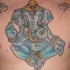 tatuaje en el pecho de Ganesha azul sentada