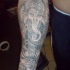 tatuaje en la manga en tinta negra de Ganesha