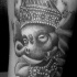 Le tatouage d'un visage ensommeillé de Ganesha