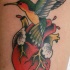 colibri col cuore realistico tatuaggio