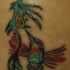 Le tatouage de colibri tribal en couleur