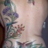 esclusivo tatuaggio sulla schiena intera fiori ecolibri