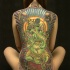 tatuaje grande en toda la espalda de ganesha verde india