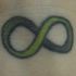 verde simbolo di  infinita' tatuaggio