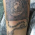 Tatto di Bibbia con rosario e croce