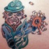 irlandese leprechaun con pistola tatuaggio colorato