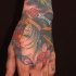 Tatuaje en la mano e una geisha japonesa