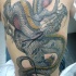 Tatuaje para toda espalda de un dragón