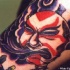 Demone giapponese colorato tatuato