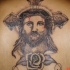 gesu' in croce con rosa tatuaggio